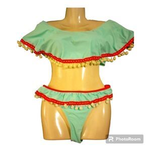 Ruffle top bikini with pom pom accent